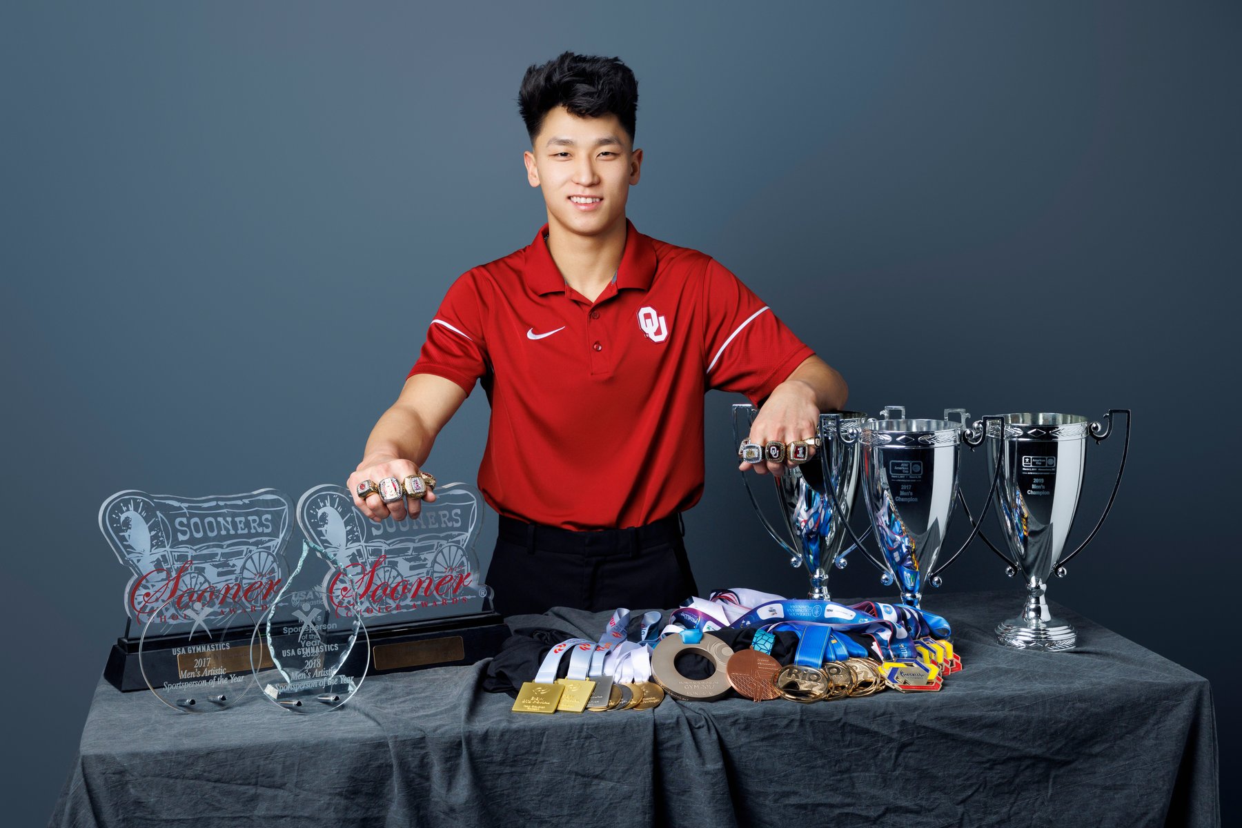 Yul Moldauer with championship trophies and medals